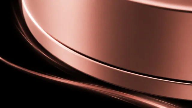 Close-up of the device’s rose-gold edge catching the light.