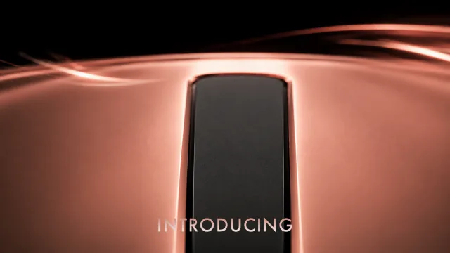 The top of the device lit from behind, with the word Introducing.